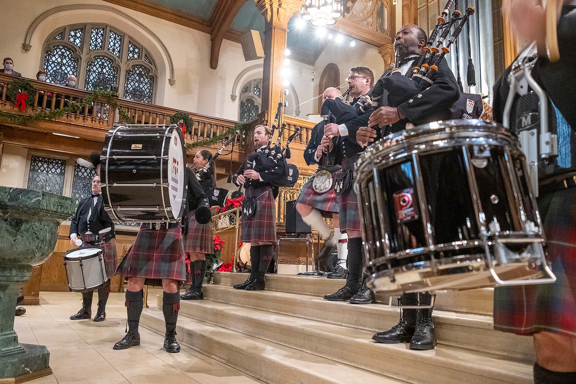 Pipes of Christmas pipers and drummers on stage